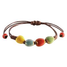 PRICES MAY VARY. VIBRANT HANDCRAFTED CERAMIC BEADS: Each bead on this bohemian bracelet is crafted from ceramic and uniquely colored, offering a vibrant spectrum from earthy greens to sunny yellows, making it a standout accessory. ADJUSTABLE LEATHER CORD: The robust leather cord is designed for longevity and comfort, featuring an adjustable knot that allows for a customized fit for any wrist size. PERFECT FOR LAYERING OR SOLO WEAR: Whether worn alone for a subtle hint of color or layered with ot Earthy Greens, Hippie Summer, Boho Style Bracelets, Leather Cord Bracelets, Earthy Jewelry, Adjustable Knot, Bohemian Bracelet, Colorful Ceramics, Bohemian Bracelets