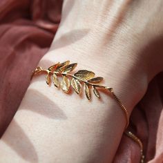 Leaf Bracelet // Woodland Wedding // Rustic Wedding // Bridesmaids Gift // Boho Bridal Jewelry // Summer Jewelry // Box Chain Bracelet // Adjustable Bracelet   This beautiful nature inspired bracelet features a large detailed leaf in gold and is secured to a dainty box chain bracelet. The leaf bracelet can be adjusted by gently moving the slider bead for a comfortable fit. Embellished to each end are tiny cubic zirconia for a dash of sparkle. Whether searching for a woodland wedding themed bracelet as a bridesmaids gift or something special to wear on your wedding day, all of my jewelry arrives suitably gift wrapped ready for gift giving. Size: The size of the leaf bracelet is adjustable and is light weight, the leaves can be gently pressed to shape and form them close to the wrist if need Rustic Wedding Summer, Dreamy Jewelry, Gold Leaf Jewelry, Boho Bridal Jewelry, Bracelet Box, Forest Theme, Leaf Bracelet, Wedding Gifts For Bridesmaids, Wedding Summer