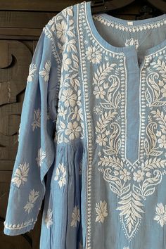 Made of soft skin-friendly pure cotton fabric, this charming light-blue handcrafted Lucknowi Chikankari A-line Women's Kurta long dress is an exceptional piece that will never go out of style. Featuring intricate Lucknowi Chikankari embroidery, it's perfect for everyday wear. Pure cotton Length 44" inches Long sleeves 19" inches Round neck A line Lucknowi chikankari embroidery handwork Soft wash Fit: True to sizeInside Margin: NoTouch and Feel: Soft and ComfortableDispatched in 1-3 business days