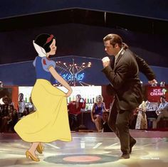 the man and woman are dancing in front of an audience at disney's live - action