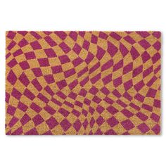 a pink and yellow door mat with an abstract design