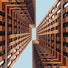 an upward view of some tall buildings