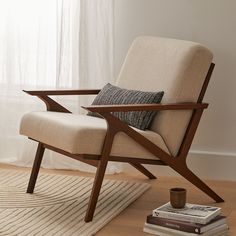 a chair sitting on top of a wooden floor next to a window