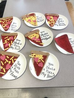 paper plates with slices of pizza on them that say, you stole my heart out