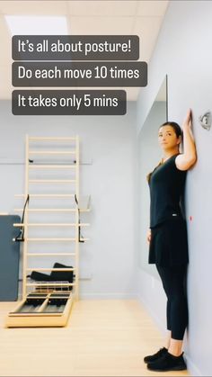 a woman leaning against a wall in a room