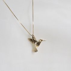 "Humming Bird Pendent Necklace . . . * Pendants Measurements With Bail: (16 x18 mm) * Gold KT: 14K Gold * Gold Color: Yellow Gold * Chain: Optional * Chain: 1 Box Chain * Stamp: 14k * Never gold filled or plated * 1-Day Shipping * Packaged With Free Gift Box . . . If you have any questions, just hit the \"Message the Seller\" button ( bottom right of the page) and we will get back to you within a few hours. . . . Check our Social Media @Talajewel, and let's be friends!  . . . Made in USA, Humming Bird Pendent Necklace, 14k Solid Yellow Gold Dainty Bird Necklace, Tiny Bird Necklace, Solid 14k Gold Charm, Gold Bird Necklace, Gift for babies, 14K Bird Charm Pendant, 14k solid gold Bird necklace, yellow gold necklace, thin chain, Dainty good luck necklace, Great for Layers. A Perfect 14K Gold Angeles, Humming Bird Necklace, Gold Bird Necklace, Pendents Gold, Gold Hummingbird, Scorpio Necklace, Hummingbird Necklace, Astrology Jewelry, Good Luck Necklace