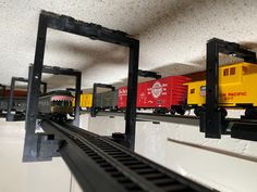 toy trains are lined up on the tracks