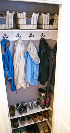 a white closet filled with lots of shoes and baskets on top of it's shelves