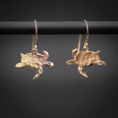 Dangle earrings - tiny gold turtle earrings, choose your favorite style: hammered or smooth. The ear wires made of 18K gold-filled - reacts and behaves just like pure gold.  ★Comes in our signature gift box, ready for gift giving.  ★ Available in Gold [gold-filled ear wire & gold plated brass ]  ★ Earring size ( turtle ) 0.50"x0.60". Thanks for shopping at ByYaeli♥  All images, texts & products are property of ByYaeli ©2022. Jewelry Design Studio, Ocean Earrings, Turtle Jewelry, Gold Skull, Ocean Jewelry, Goth Jewelry, Turtle Earrings, Fan Earrings, Tiny Earrings