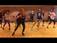 a group of young women dancing in a dance studio