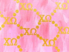 an abstract painting with gold letters and circles on pink paper, which has been drawn by hand