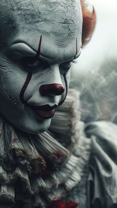 a creepy clown with red hair and white makeup