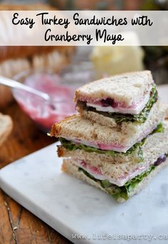 two sandwiches stacked on top of each other with the words easy turkey sandwiches with cranberry mayo