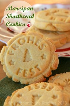 some cookies are sitting on a plate with the words marzipan shortbread cookies