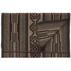 a brown and black blanket with geometric designs