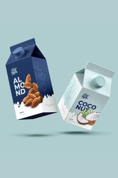 two milk cartons with almonds in them on a blue and white background, one is