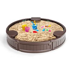 a sandbox with toys in it on a white background