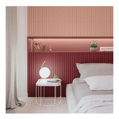 a bedroom with pink walls and a white table next to the bed in front of it