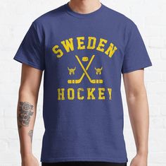 a man wearing a sweden hockey t - shirt