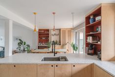 the kitchen is clean and ready to be used as a living room or dining area