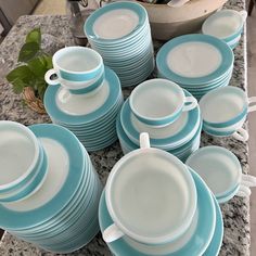 a table topped with lots of blue and white dishes