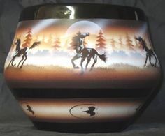 this is a vase with horses on it