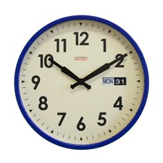 a blue and white wall clock with the time eleven o'clock in front of it