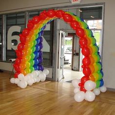 an arch made out of balloons on the floor