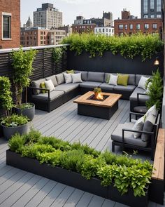 an outdoor living area with couches, tables and potted plants on the deck