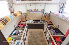 the inside of a camper with lots of drawers