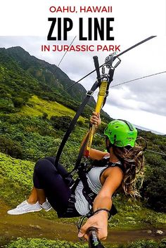 a woman on a zip line in the mountains