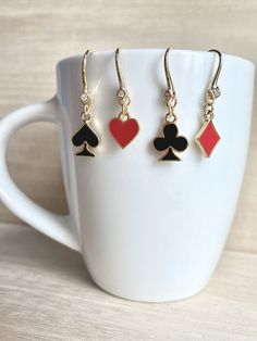 These dainty poker cards / playing cards earrings are made of the followings: (1) Gold plated red enamel diamond charm (15 x 9mm) (2) Gold plated red enamel heart charm (11.5 x 10mm) (3) Gold plated black enamel club charm (15 x 11mm) (4) Gold Plated black enamel spade charm (15 x 10mm) (5) Gold plated earring hooks with rhinestone ✏️You may choose either to buy a whole set of earrings or choose a pair of your favourite suits. ♠️ Other Style ♣️ Threaders -> https://www.etsy.com/listing/471296 Cards Playing, Ace Of Spades, Poker Cards, Diamond Charm, Earrings Dainty, Earring Hooks, Gold Plated Earrings, Black Enamel, Heart Charm