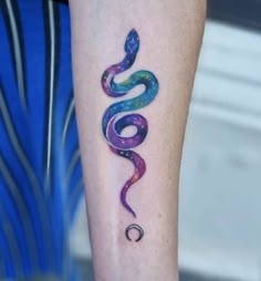 a colorful snake tattoo on the right arm and leg, with stars in the background