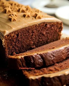 a loaf of chocolate cake with frosting on top