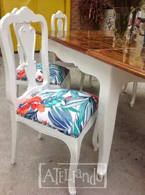 a white table with two chairs next to it