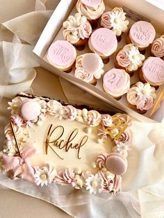 a box filled with cupcakes sitting on top of a table