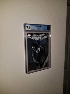 the amazing spider - man movie poster is hanging on the wall next to a door