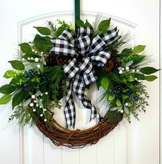 a wreath is hanging on the front door