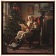 an old man sitting in a chair reading a book next to a christmas tree with presents on the floor