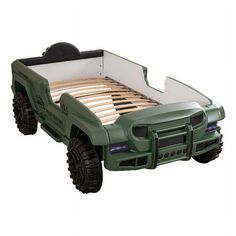 a toy truck bed with two large tires on it's sides and an attached platform