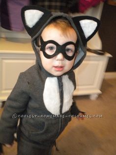 a little boy dressed up as a cat