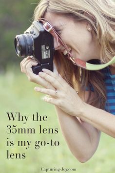 a woman holding a camera and taking a picture with the caption, why the 35mm lens is my go - to lens