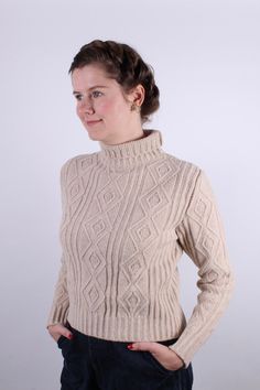 The vintage-style pullover is soft and extra warm. Made of 100% pure Merino wool with a lovely cable knit pattern. The pullover is feminine, simple, and very classical. It is with a turtleneck, a short length that just ends below the waist, and with long sleeves. The sleeves can be adjusted in length using the wide rib edge at the wrist, which can be folded up according to the desired length and needs.The pullover is very warm, soft, and perfect for cold winter days.The Merino yarn is made in It 1920s Shoes, 1940s Shoes, Style Turtleneck, Vintage Style Shoes, Cable Knit Pattern, Vintage Knitwear, Winter Fashion Boots, Turtleneck Pullover, Vintage Boots