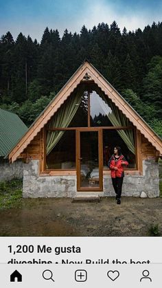 a woman standing in front of a small cabin