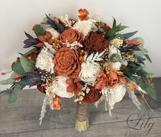 a bridal bouquet with orange and white flowers