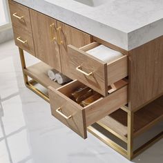 a bathroom vanity with two drawers and a marble counter top in front of the sink