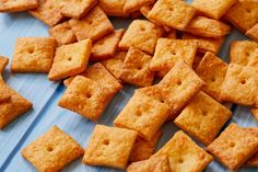 a pile of crackers sitting on top of a blue table