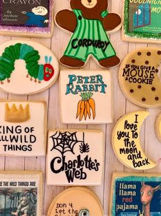 decorated cookies are arranged in the shape of children's books