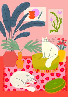 two cats are sitting on the table in front of plants