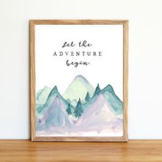 a watercolor painting with the words, let the adventure begin on it and mountains in the background